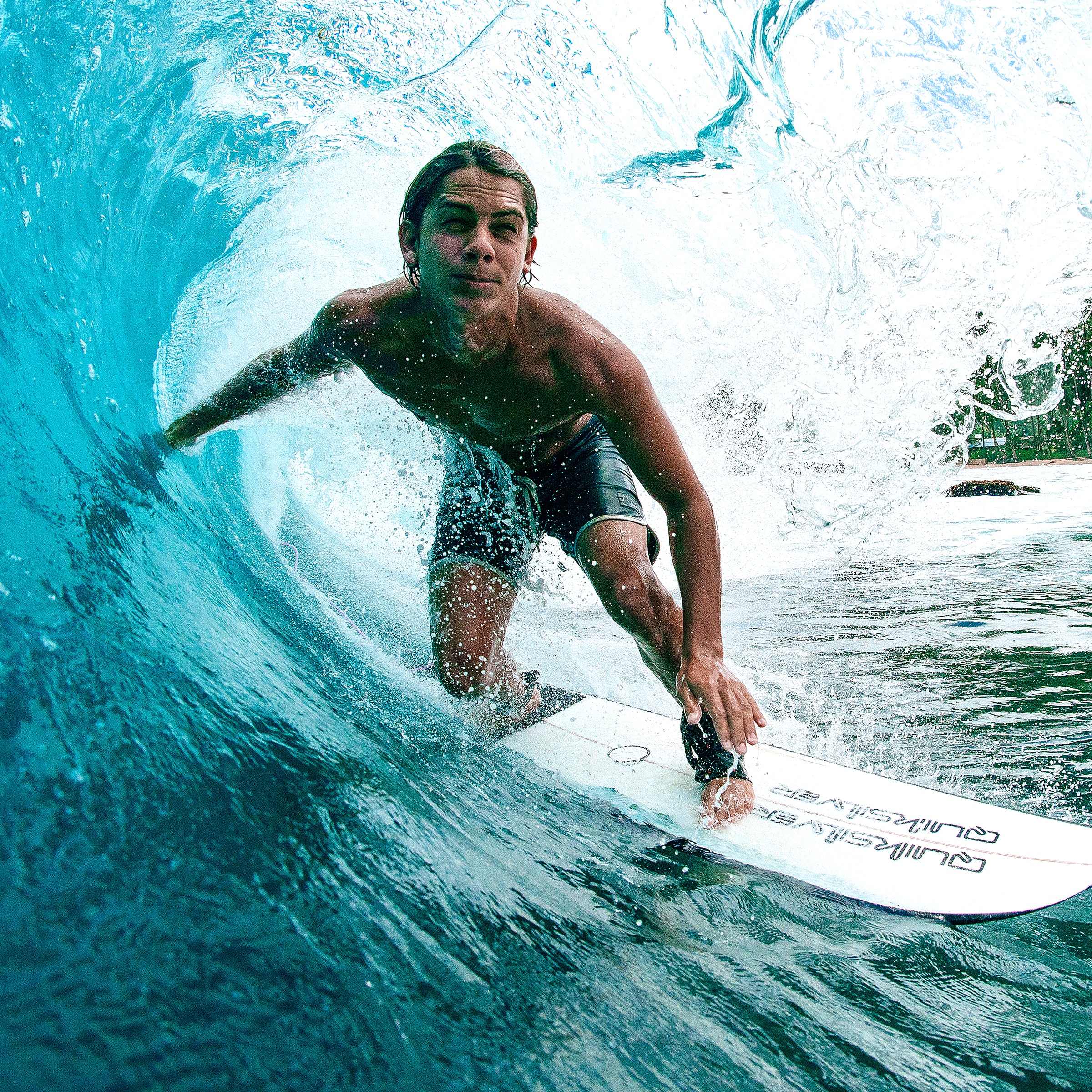 Person surfing on a wave with a surfboard