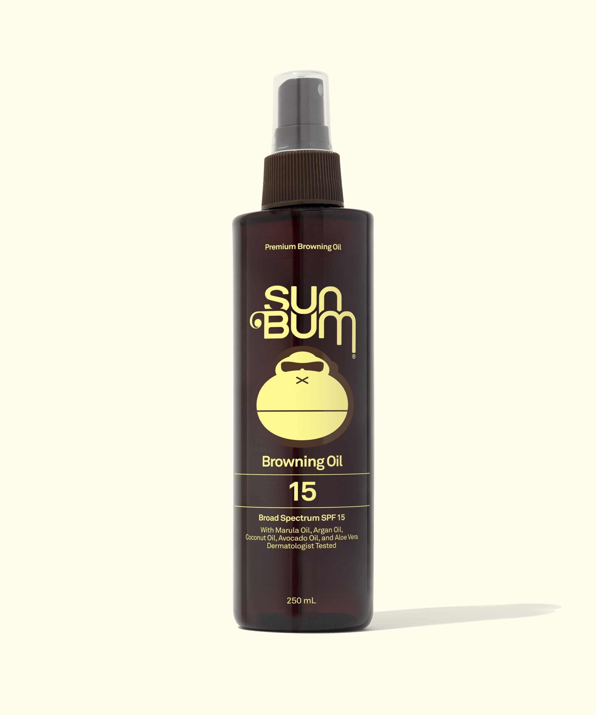 A bottle of Sun Bum Browning Oil SPF 15 with a spray nozzle, primarily brown in color with a white label displaying the product details.