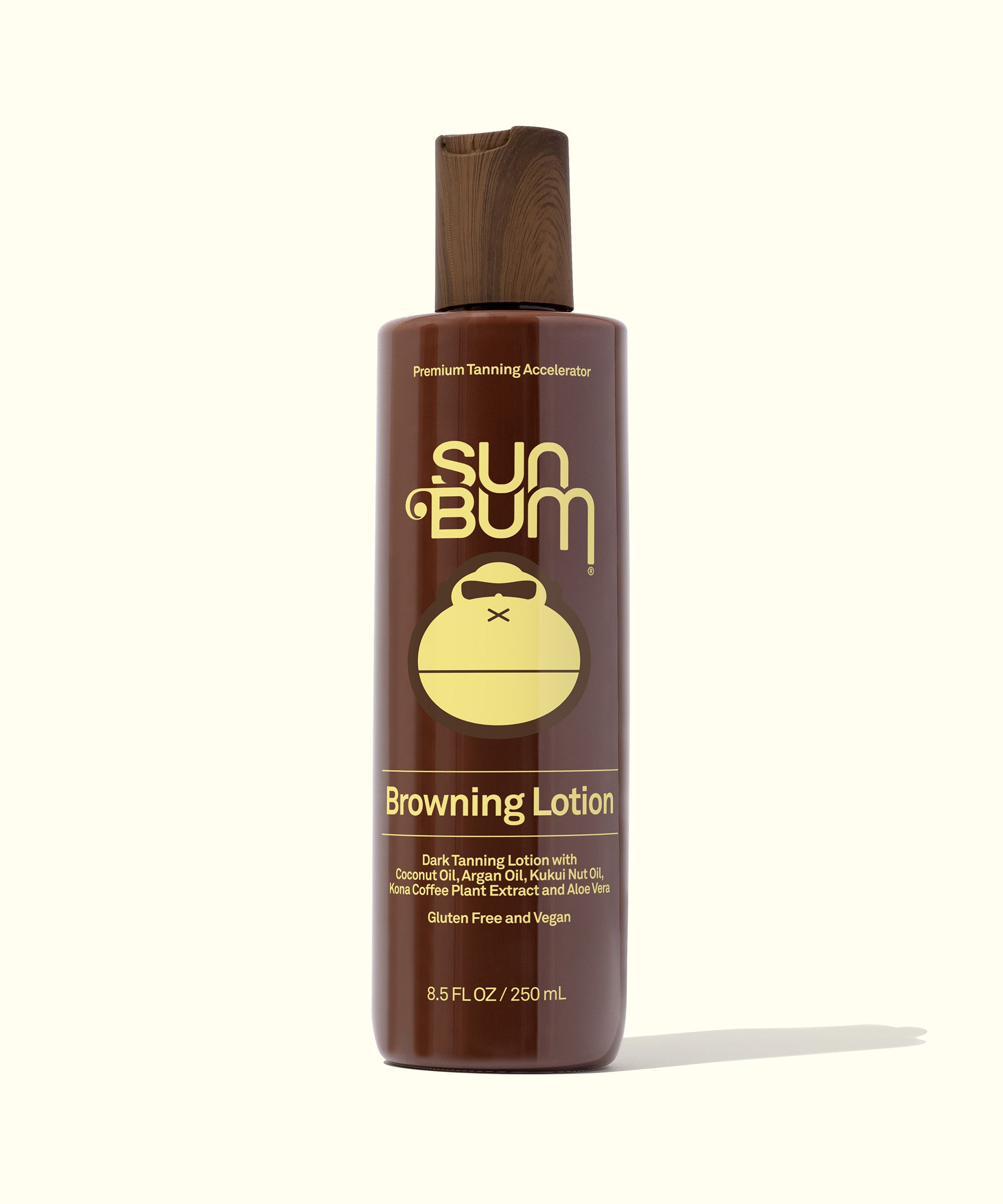 A bottle of Sun Bum Browning Lotion with brown packaging and a label featuring the Sun Bum logo.