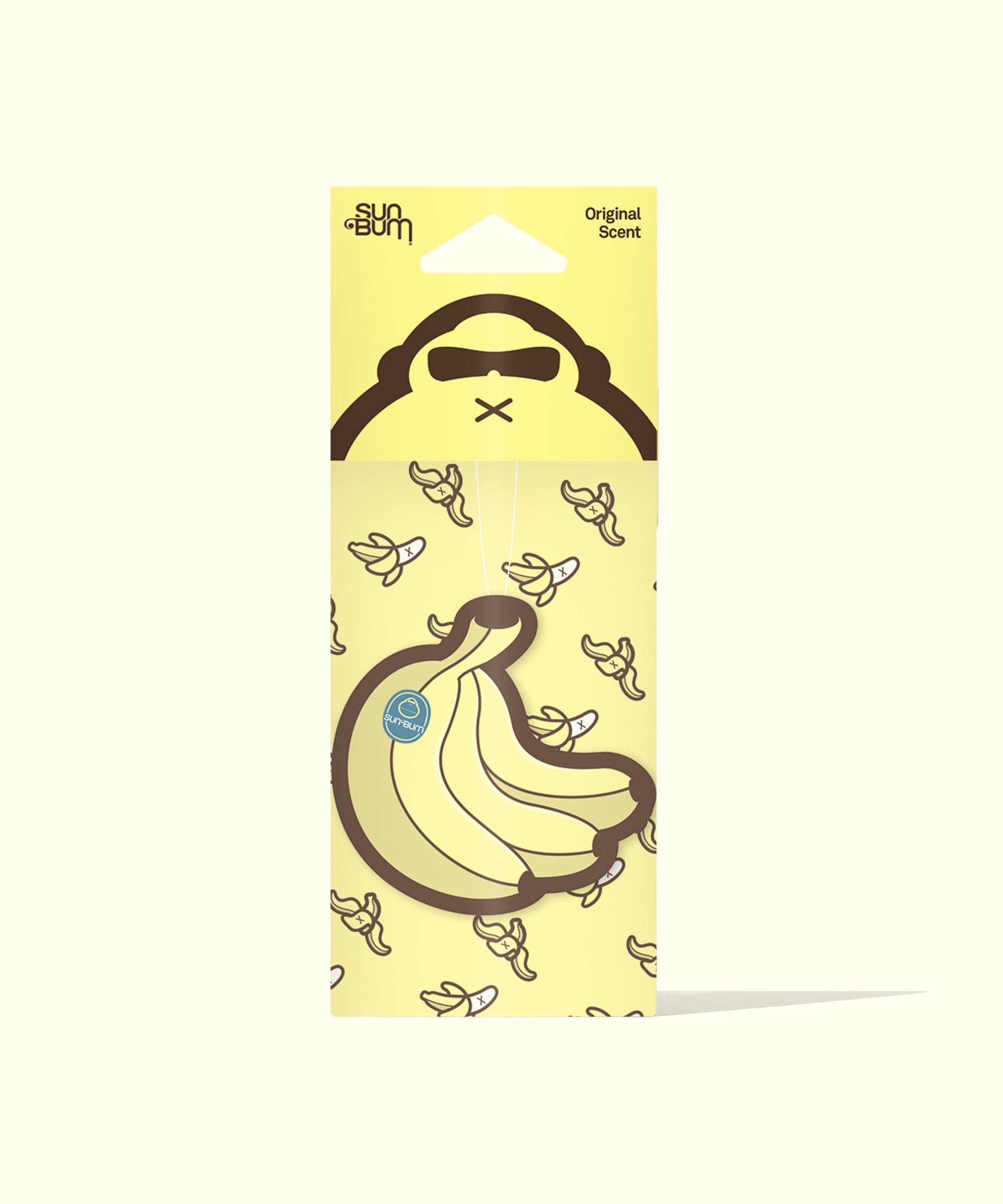 A package of a banana-shaped air freshener with a yellow background, featuring illustrations of bananas and a character named 'Sun Bum'.