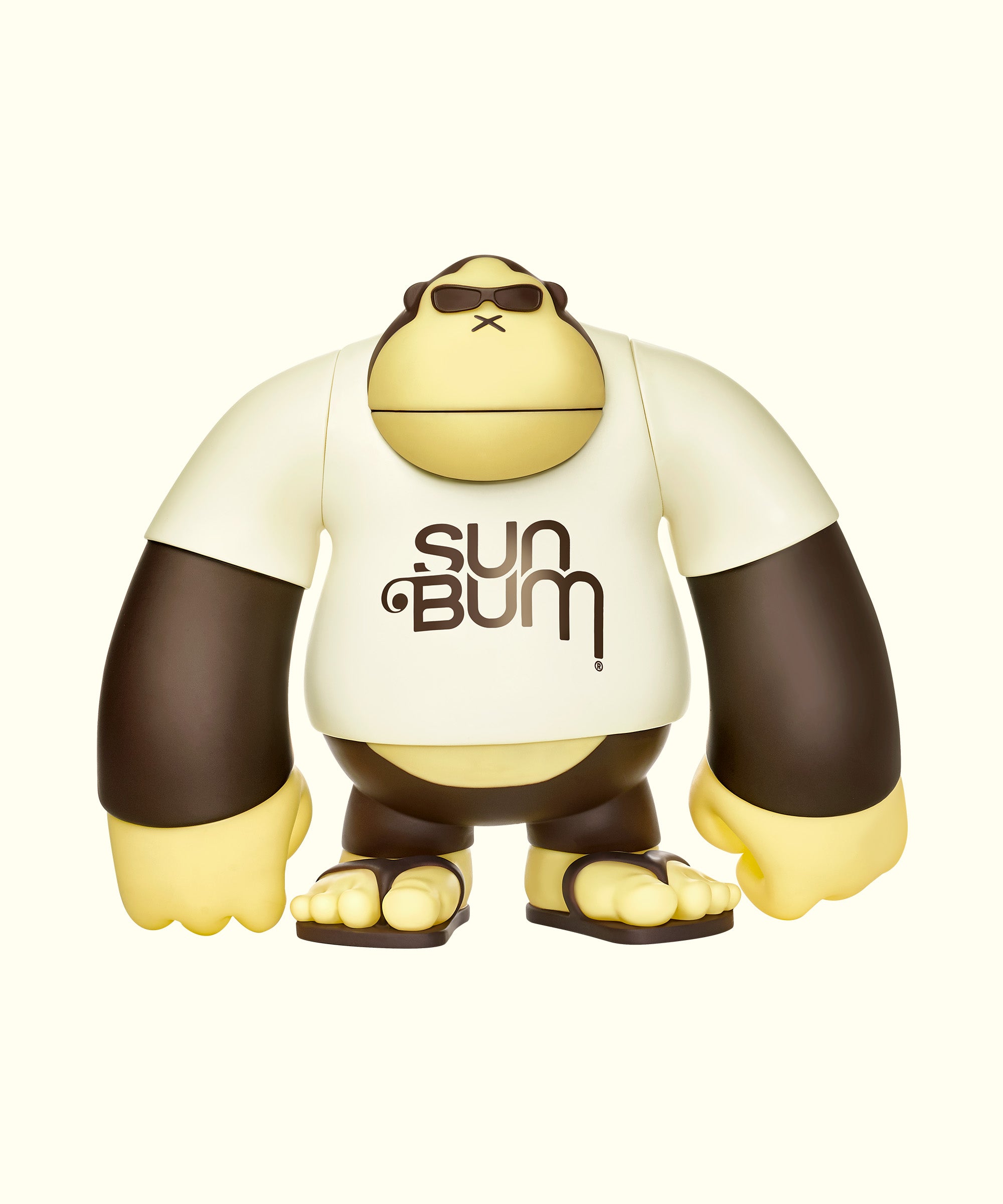 A vinyl figure of an stylized ape character wearing a white shirt with the text 'SUN BUM' on it.