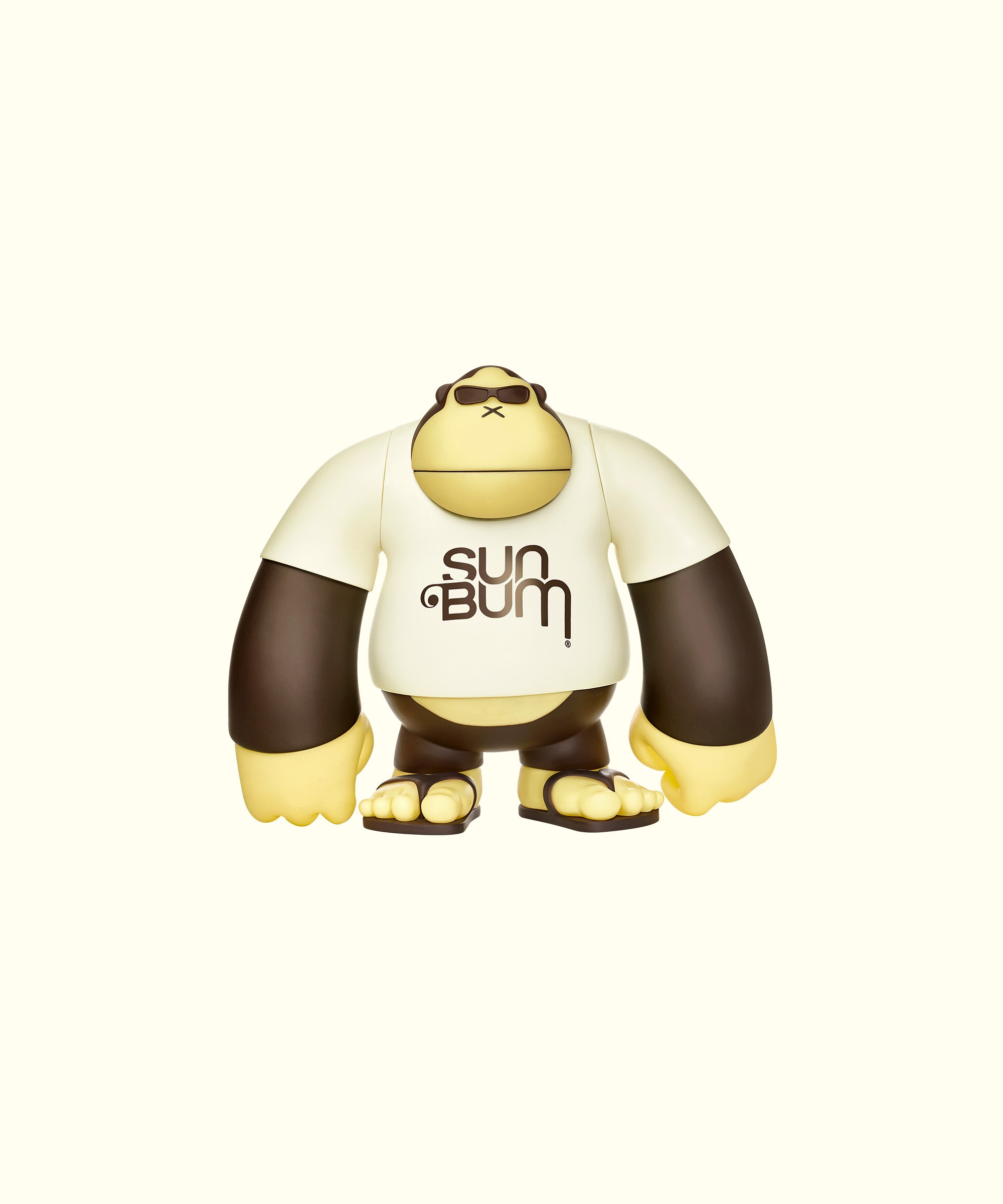 A 9-inch vinyl figure of a character wearing a white shirt with the text 'SUN BUM' on it, predominantly in beige and white colors with black sleeves and feet.