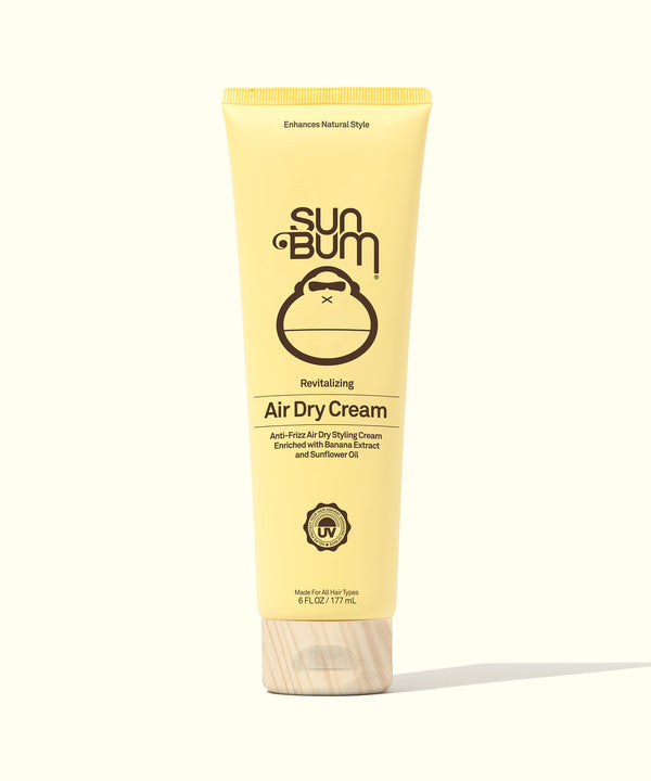 A tube of Sun Bum Revitalizing Air Dry Cream with yellow packaging.