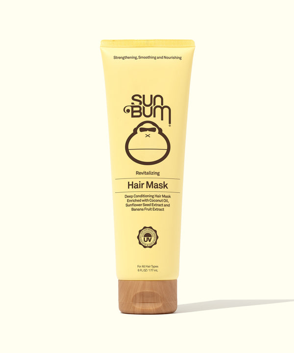 A tube of Sun Bum Revitalizing Hair Mask with a yellow label and a brown cap, designed for nourishing dry and damaged hair.