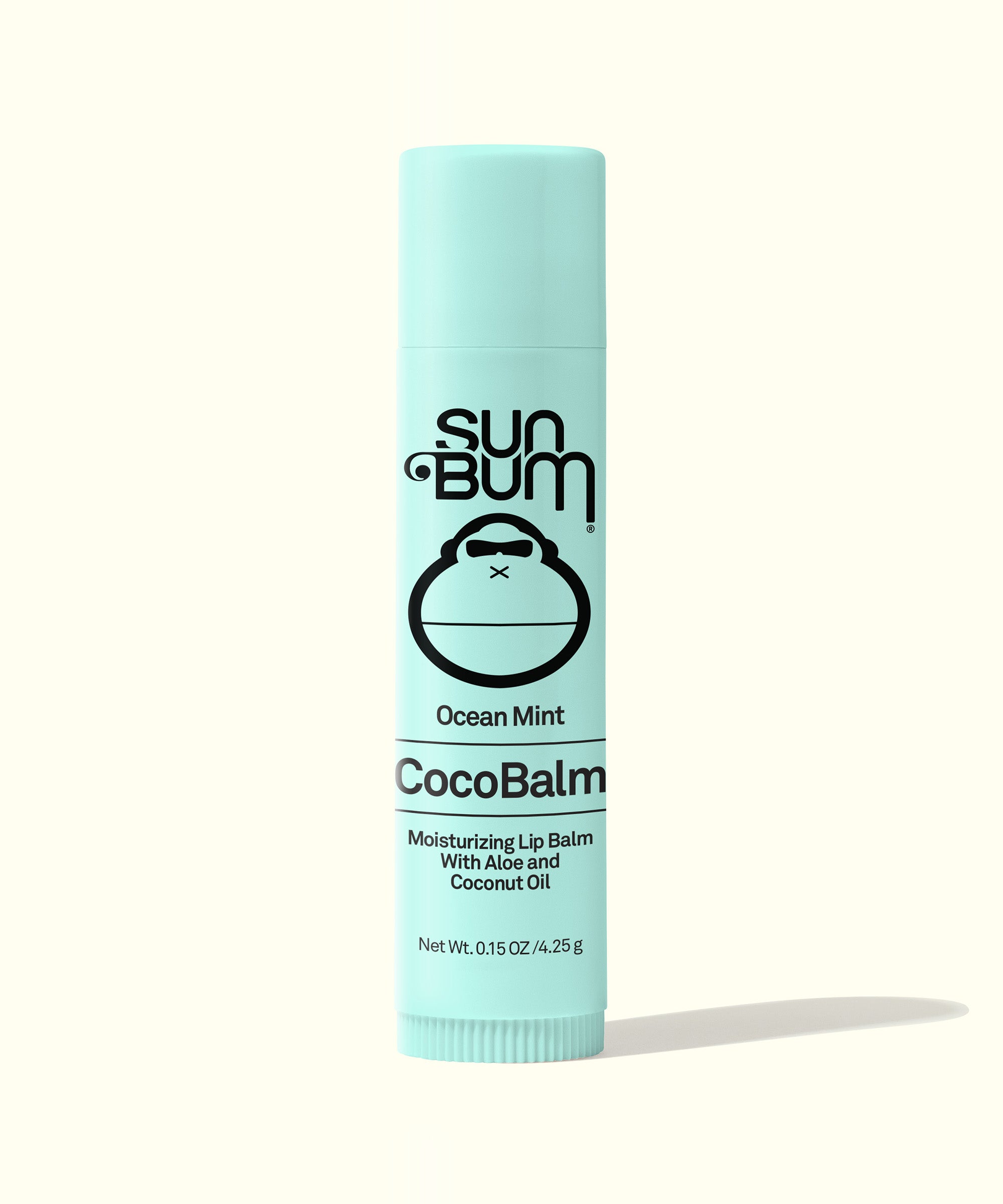 A stick of Sun Bum CocoBalm Lip Balm in Ocean Mint flavor, packaging is predominantly white with blue accents and product information.