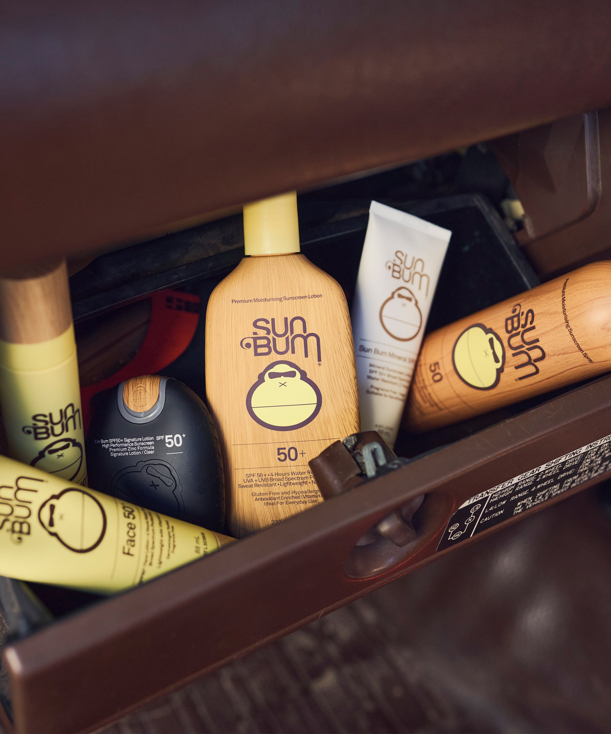 Sun Bum sunscreen products in a suitcase