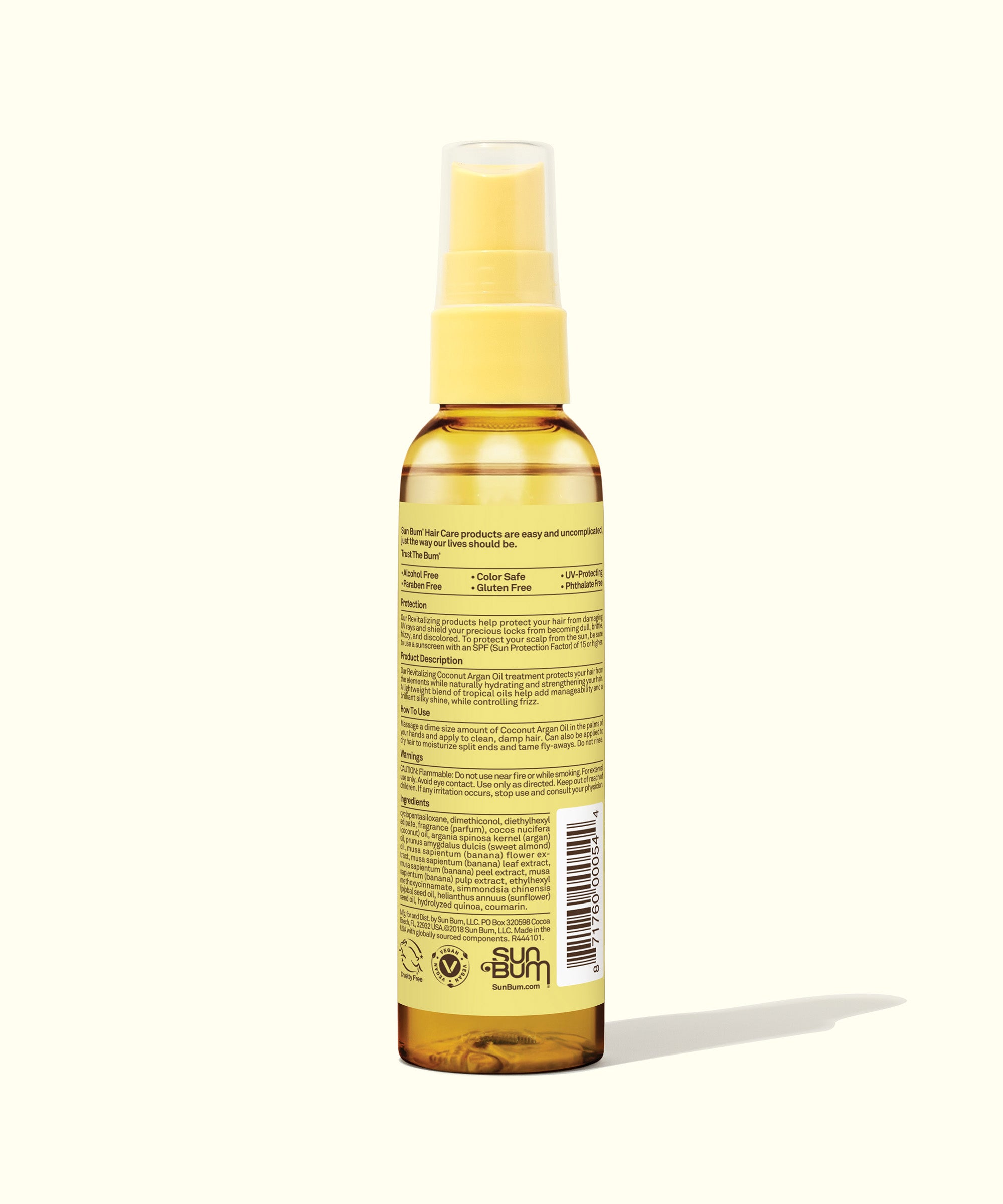 Yellow bottle of Coconut Argan Oil hair treatment, perfect for hydrating and strengthening your hair with tropical oils blend, brand Sun Bum.