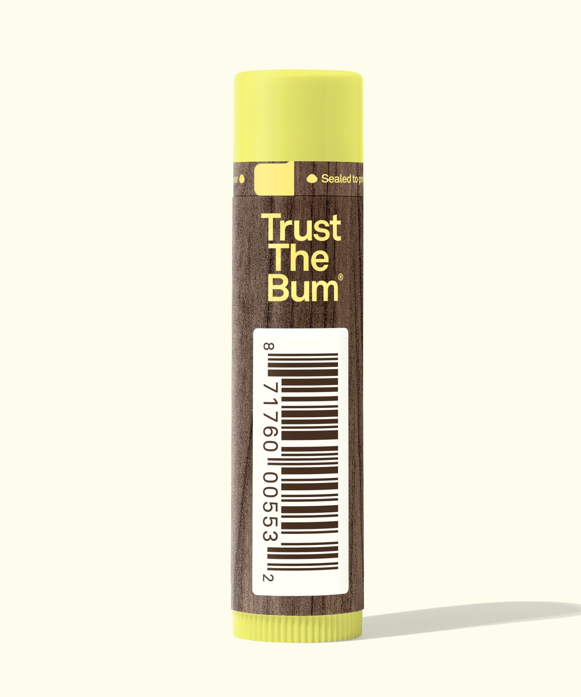 Lip balm with 'Trust The Bum' text on a white background
