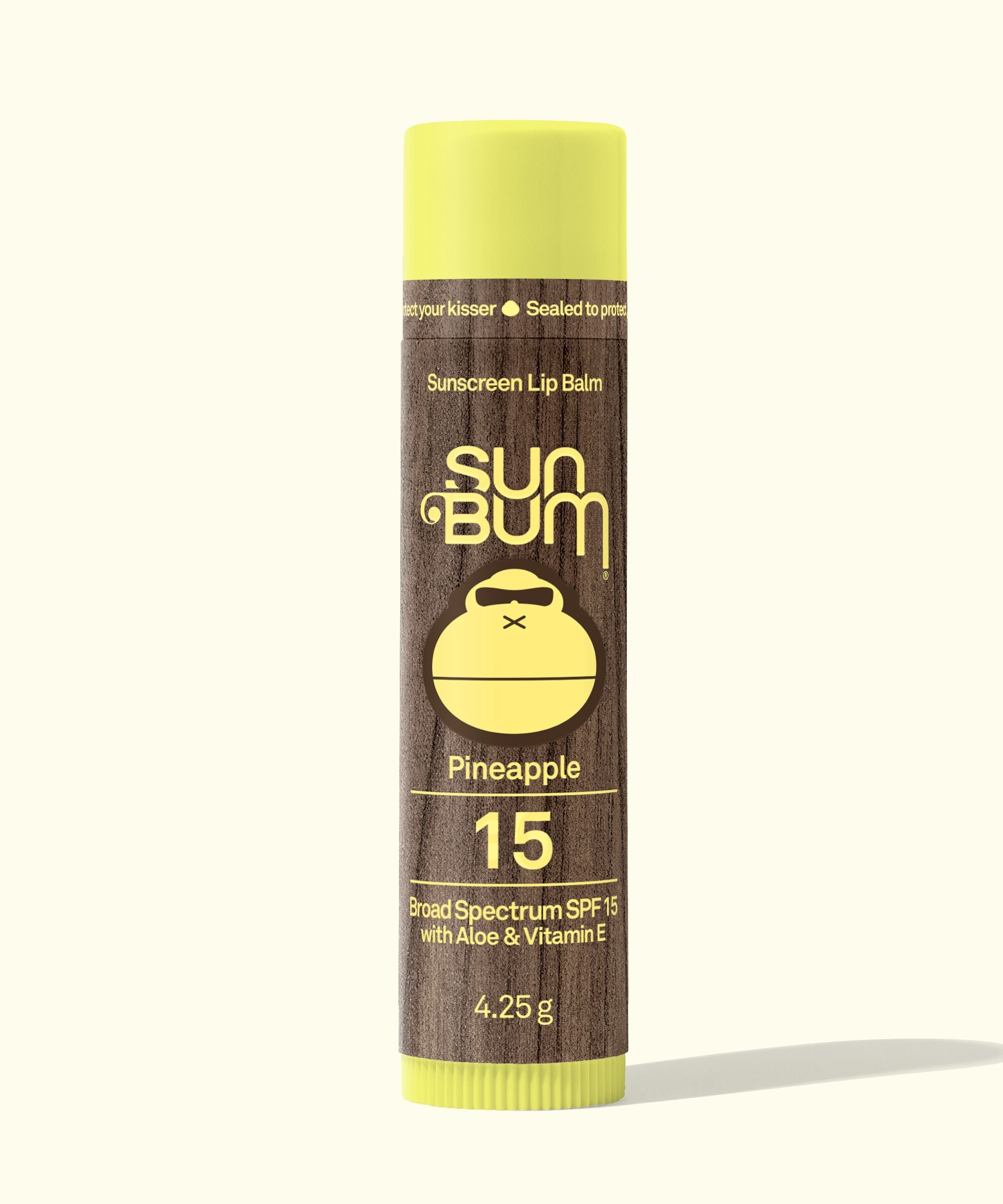 Sun Bum Sunscreen Lip Balm tube with pineapple flavor on a white background