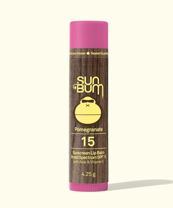 Sun Bum suncreen lip balm with pink cap and brown body on a white background