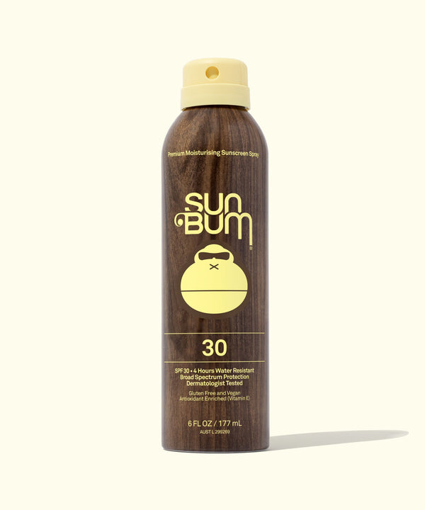 A bottle of Sun Bum Original SPF 30 Sunscreen Spray with a brown label and yellow cap.