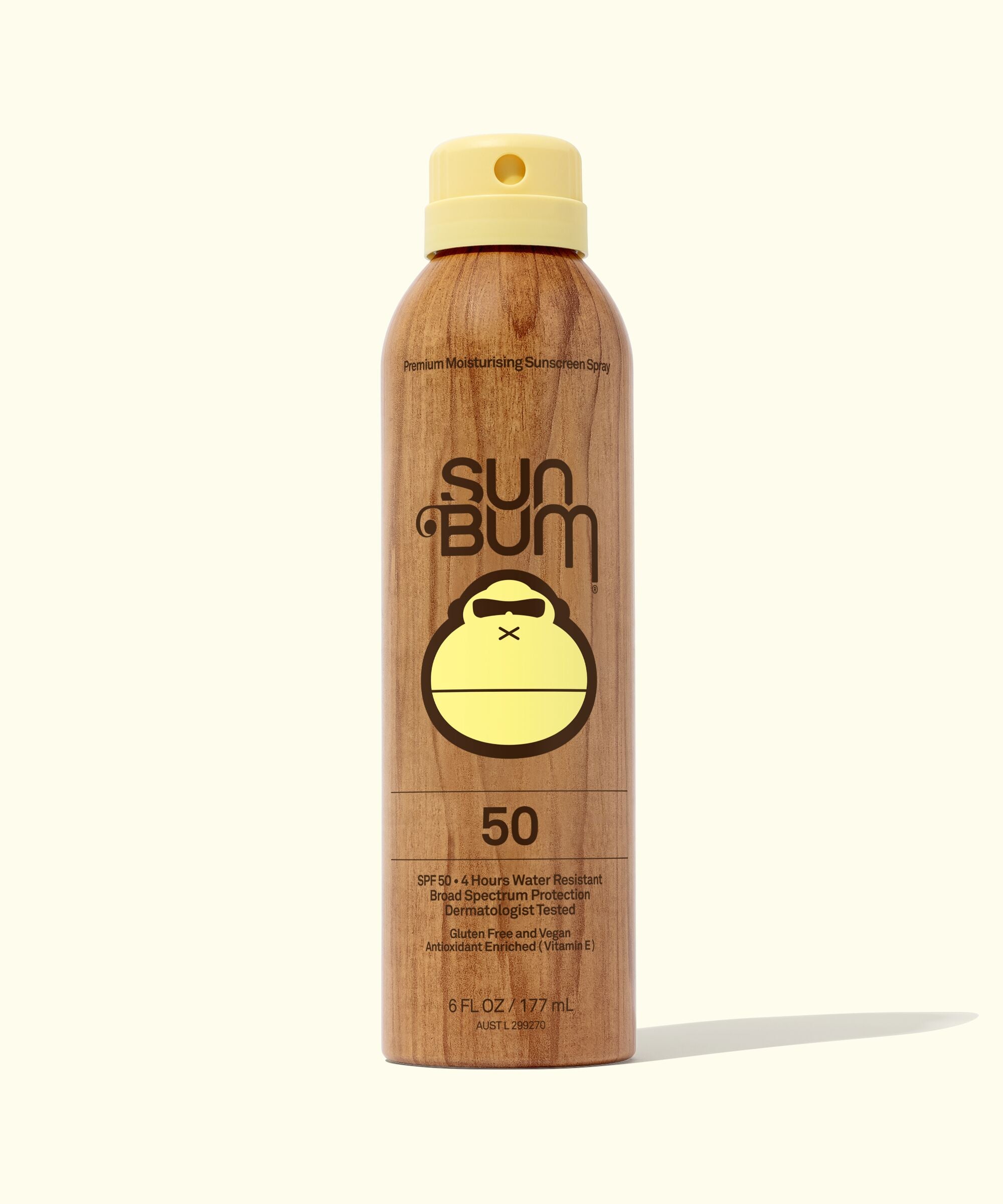 A bottle of Sun Bum Original SPF 50 Sunscreen Spray with a beige color and a yellow cap.