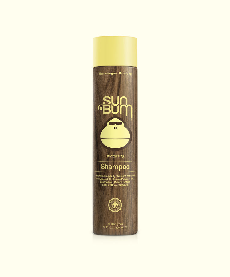 A bottle of Sun Bum Revitalizing Shampoo with a brown and yellow label, indicating it is a hair care product.